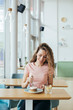 © Westend61 - Young woman enjoying her cake