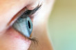 Profile of a woman's blue eye