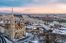 Aerial Cityscape From Budapest With Cloudly Sky, Matthas Church, Fishermans Bastion, Danube River And Hungarian Parliament.