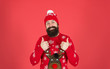 © be free - Feeling awesome. Buy festive clothing. Sweater with deer. Hipster cheerful bearded man wear winter sweater and hat. Happy new year. Join holiday party craze and host ugly christmas sweater party