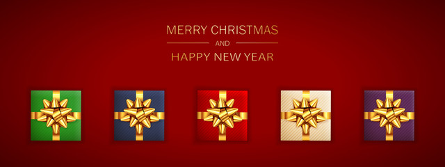 Wall Mural - Christmas Gifts with Golden Holiday Bow on Red Background