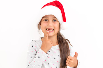 Wall Mural - Cute little girl in the santa claus hat on a white background