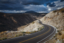 Dramatic Cloudscape Over Empty Road Through Scenic Canyon, Santa Rosalia, Baja California, Mexico