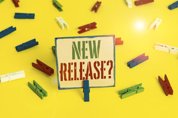 Word writing text New Release Question. Business photo showcasing asking about recent product or service newly unleashed Colored clothespin papers empty reminder yellow floor background office