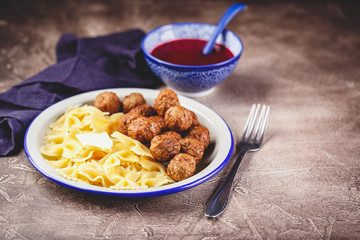 Canvas Print - Meatballs with cranberry sauce.Stewed meatballs in sweet berry sauce. Top view, flat lay