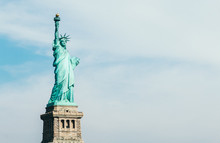 Front View Of Statue Of Liberty In New York With Blue Sky And Copy Space For Text