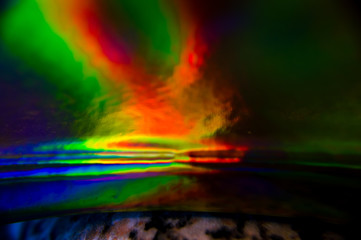 Holographic, goniochromism macro rainbow texture. Ligh leaks, disco illumination effect. Abstract background