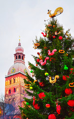 Wall Mural - Cityscape with Christmas Market at Dome Cathedral square in Winter Riga, Latvia. Advent Fair Decoration and Stalls with Crafts Items on the Bazaar. Latvian street Xmas and holiday