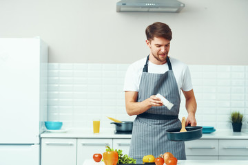 Wall Mural - young man in kitchen