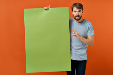 Wall Mural - man holding a blank board