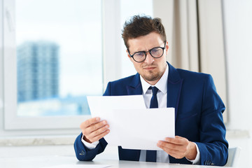 Poster - businessman holding a blank card