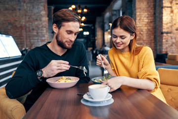 Wall Mural - young couple having dinner in restaurant