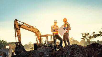 Engineers discussion with architects work planing in construction site