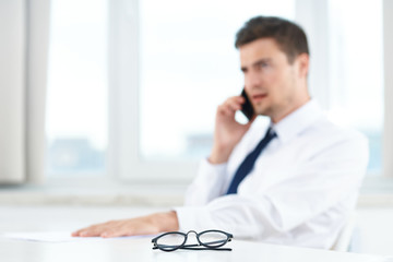 Poster - young businessman talking on the phone