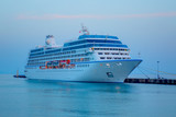 Fototapeta  - Beautiful white giant luxury cruise ship on stay at Alanya harbor