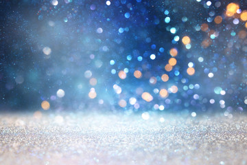 abstract glitter silver and blue lights background. de-focused