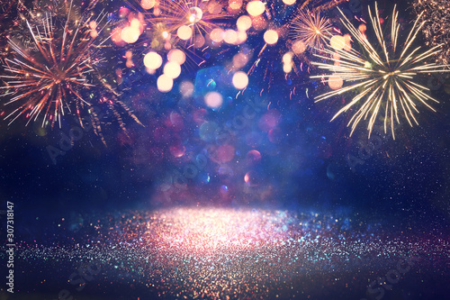 Fotomural abstract gold, black and blue glitter background with fireworks