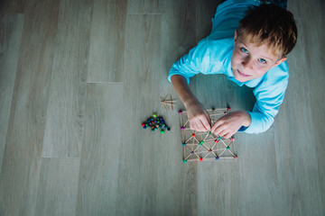 Wall Mural - child making geometric shapes, engineering and STEM