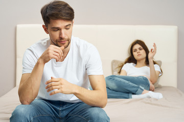 couple sitting on sofa and watching tv