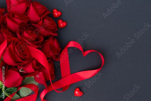 Red blooming roses on wood
