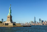 Fototapeta Nowy Jork - Panorama of the Statue of Liberty with the skyline of Manhatten in the background, New York, United States of America.