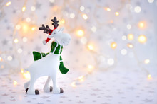 Christmas Background With Decorative Moose On Festive Lights Background