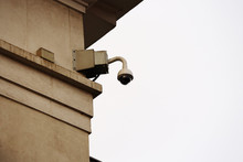 Round Panoramic Video Security Camera On Old City Building Corner