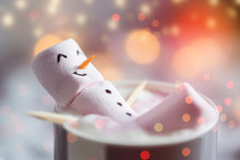 Cute Little Snowman Made From Marshmallows Bathing In A Mug With Hot Chocolate 
