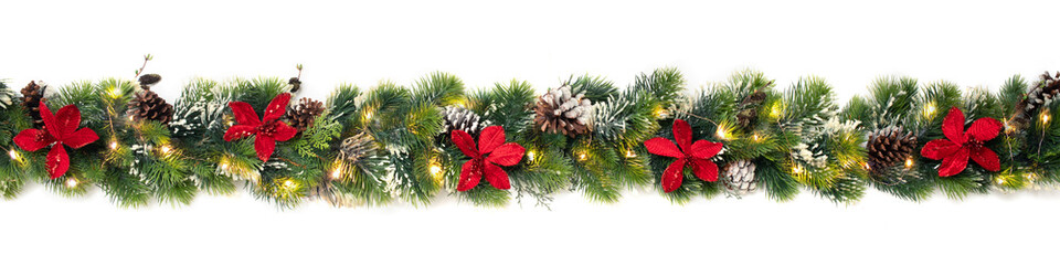 christmas tree garland decorated with red christmas poinsettia flowers and shiny led lights, festive