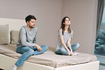 couple sitting on sofa and watching tv