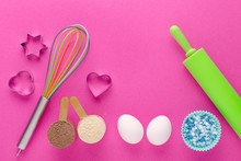 Baking Protein, Eggs And Kitchen Tools With Cookie Cutter On Pink Background