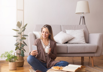 Young woman chatting with friends on cellphone