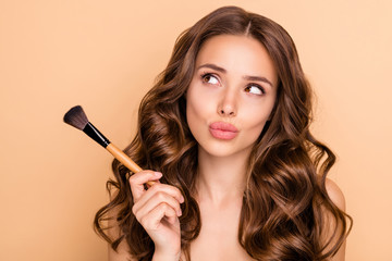 Wall Mural - close up photo of uncertain unsure girl hesitate hold blush blusher dont know apply powder rouge to 