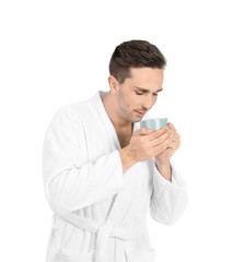 Poster - Handsome man in bathrobe and with cup of coffee on white background