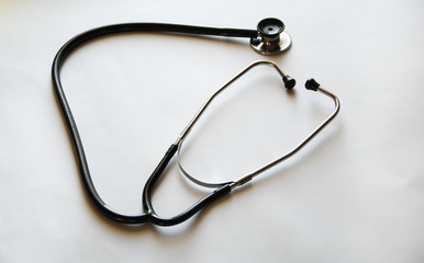 Medical stethoscope or phonendoscope in black isolated on white background 