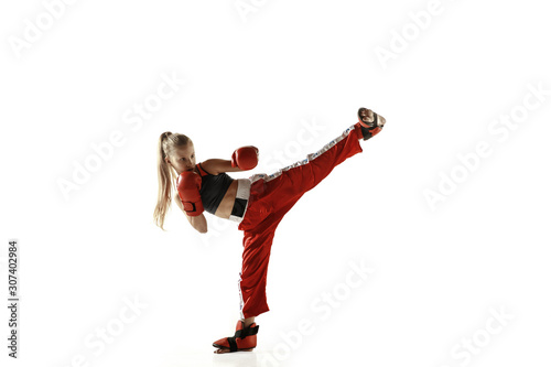 Young female kickboxing fighter training isolated on white background Lerretsbilde