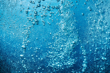 Canvas Print - Sparkling Mineral Water Background. Blue bubbles of fresh soda float to the surface of drink to quench your thirst