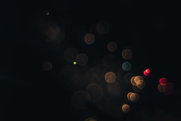 Poster - Beautiful magic gold bokeh background in the darkness.
