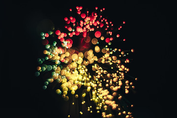Poster - Beautiful magic gold and red bokeh background in the darkness.