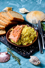 Sticker - Grilled salmon with couscous and sauce, selective focus