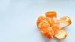 peeled tangerine on a white background.Orange fruits and peeled segment Isolated. Pile of orange segments