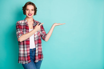 Wall Mural - Portrait positive cheerful girl point index finger hold hand indicate ads promo recommend choose decide choice decision advise advice wear good look outfit isolated pastel color background