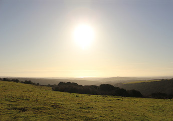 Wall Mural - A view from Butser Hill towards the Isle of Wight, with the Solent shining on the horizon.