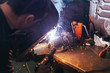 © David Herraez/ADDICTIVE STOCK - Professional welder in mask welding metal