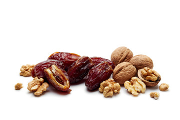 Wall Mural - Dates and walnuts on white background.