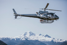 Helicopter Flying Over Mount Baker, Washington