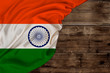 © kittyfly - color national flag of modern state of india, beautiful silk, old wood background, concept of tourism, economy, politics, emigration, independence day, copy space, template, horizontal
