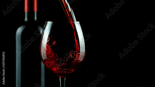 Detail of pouring red wine into glass © Jag_cz