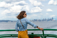Stylish Woman Is Enjoying The Ride Aboard Washington Ferry In Seattle