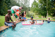 © Greatstock - People having fun at the pool